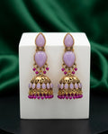 Ornate earrings with pink stones and gold accents