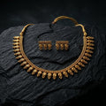 Gold necklace and earrings