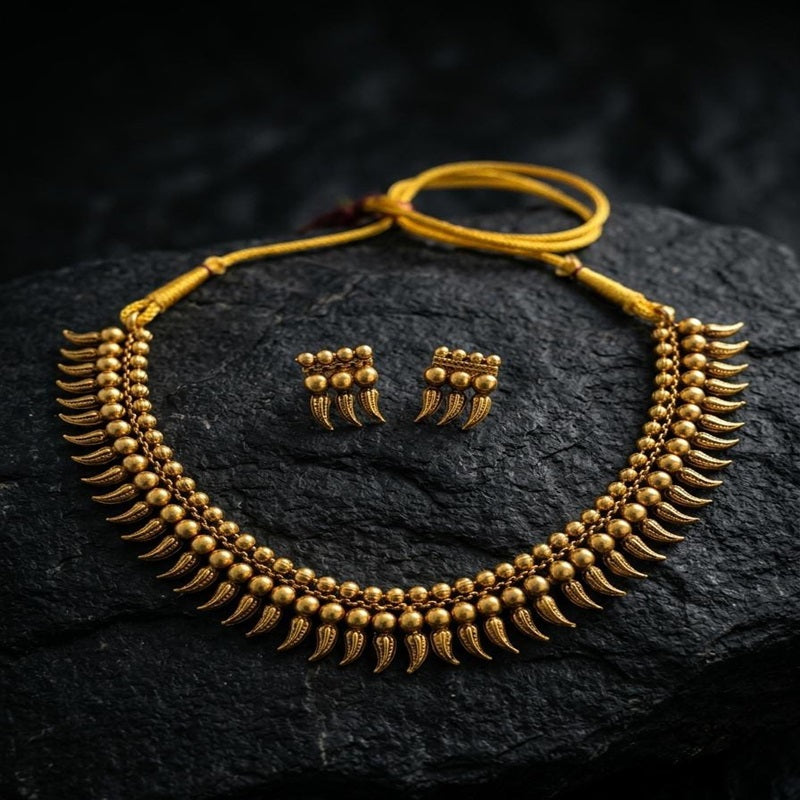 Gold necklace and earrings