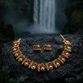 Gold necklace and earrings with colored stones