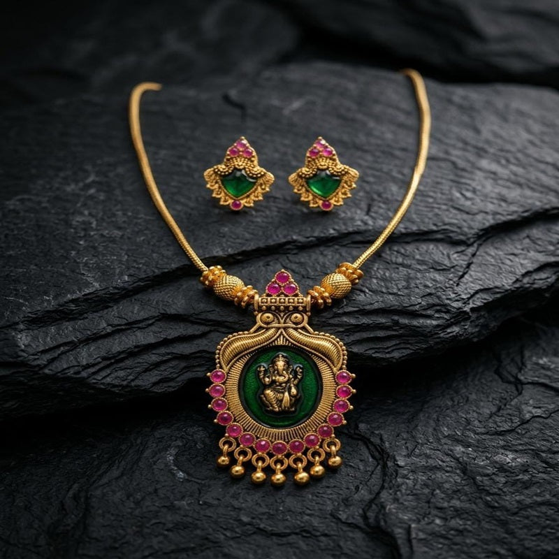 Gold necklace with green and red stones